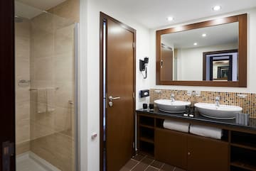 a bathroom with a mirror and sink