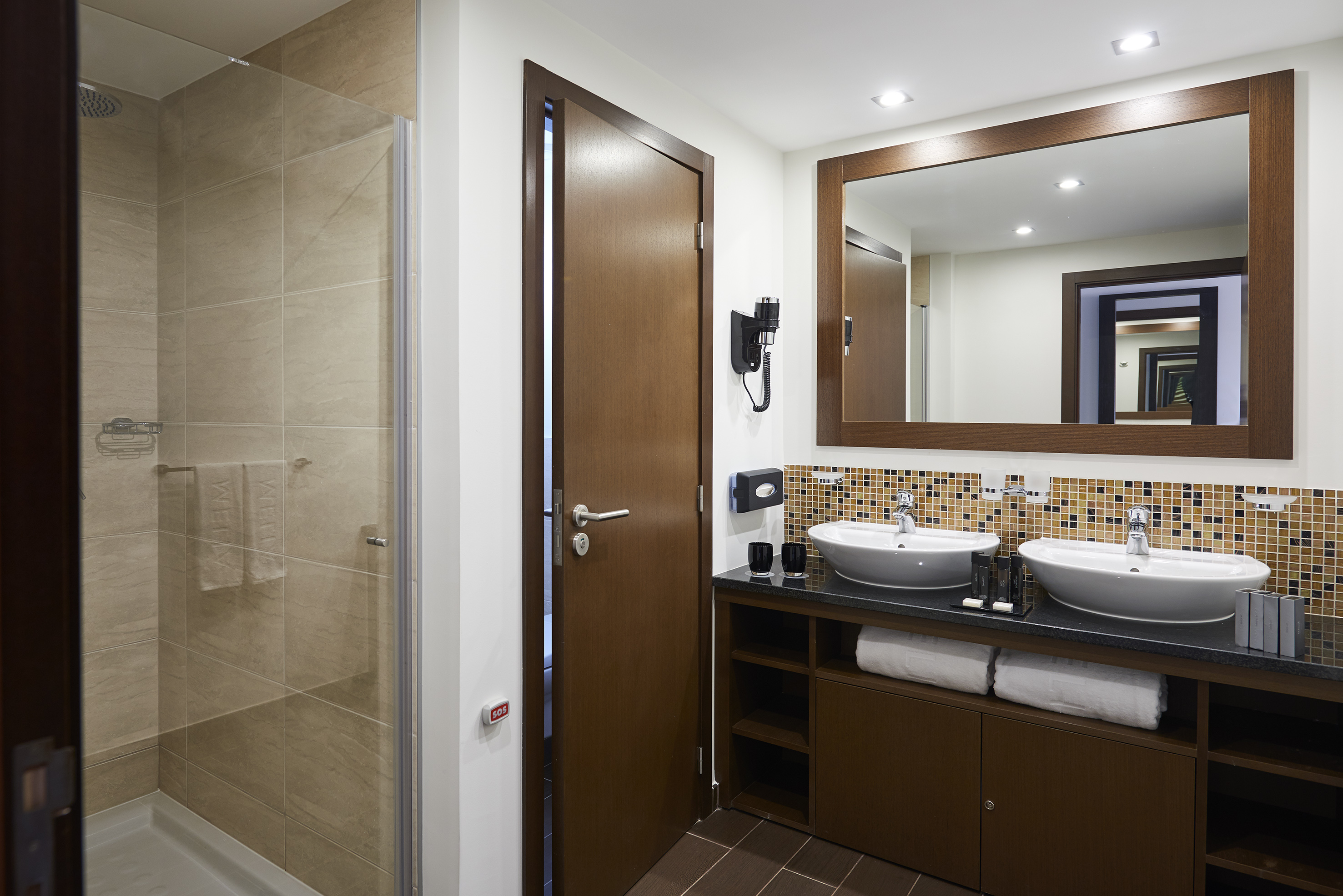 a bathroom with a mirror and sink