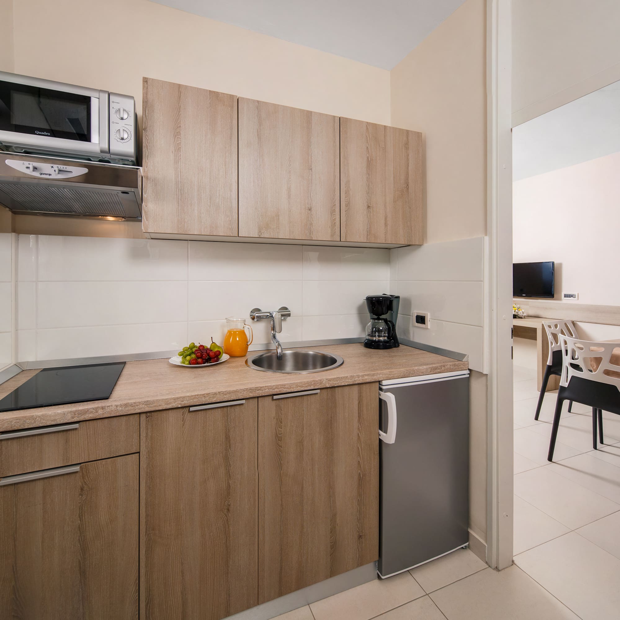 a kitchen with a sink and a microwave