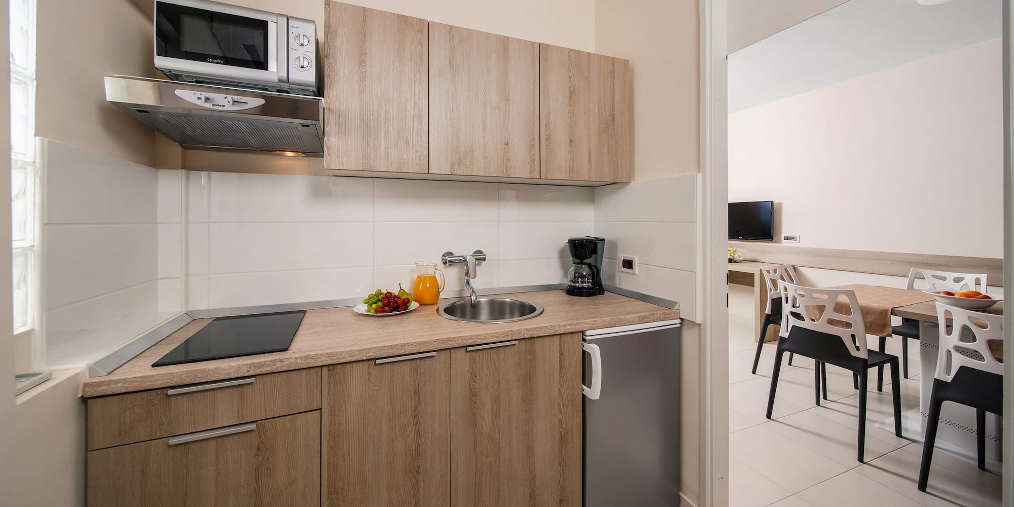 a kitchen with a sink and a microwave