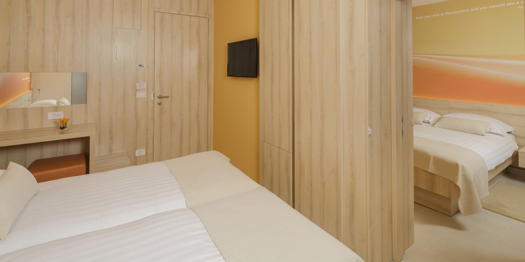 a room with a bed and a tv