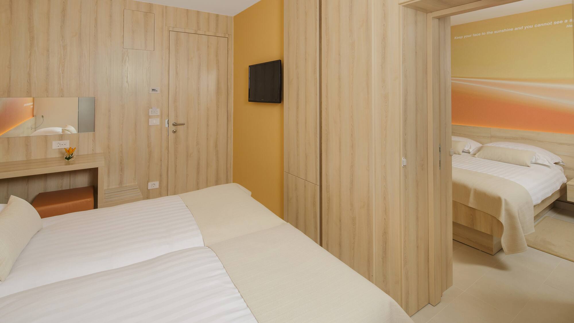 a room with a bed and a tv