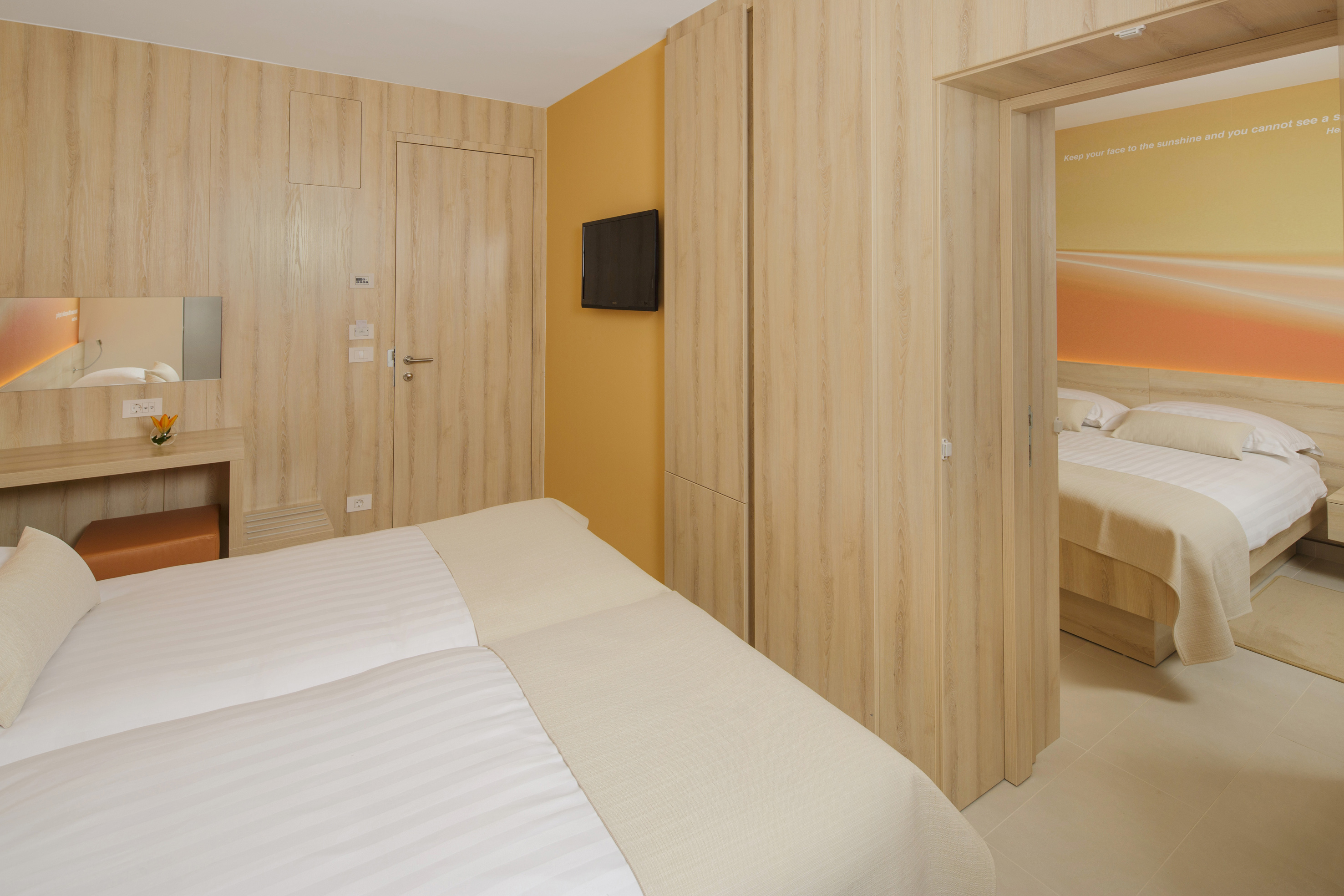 a room with a bed and a tv