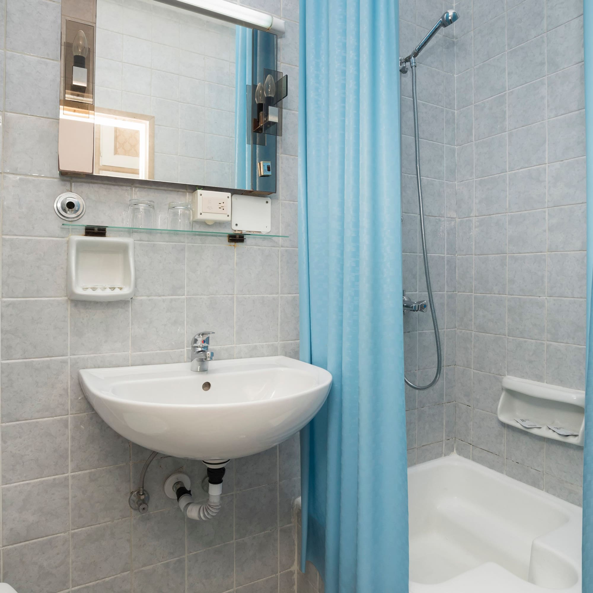 a bathroom with a sink and shower curtain