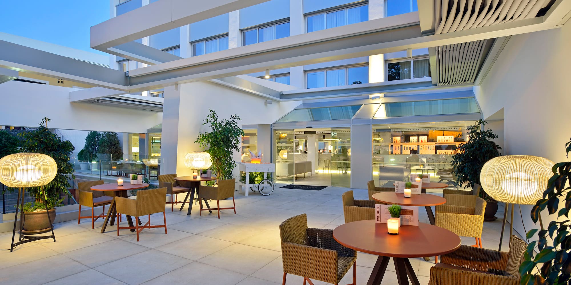 a patio with tables and chairs