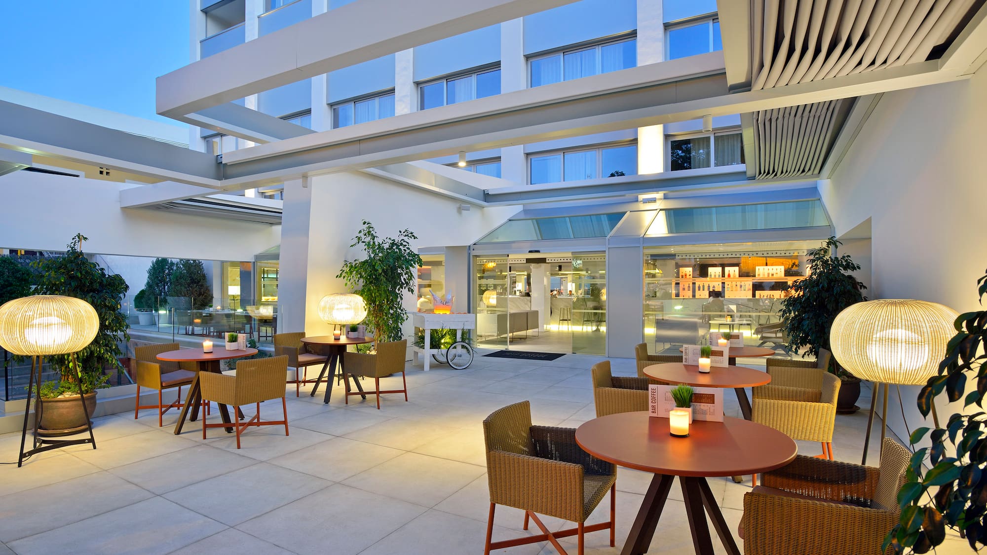 a patio with tables and chairs