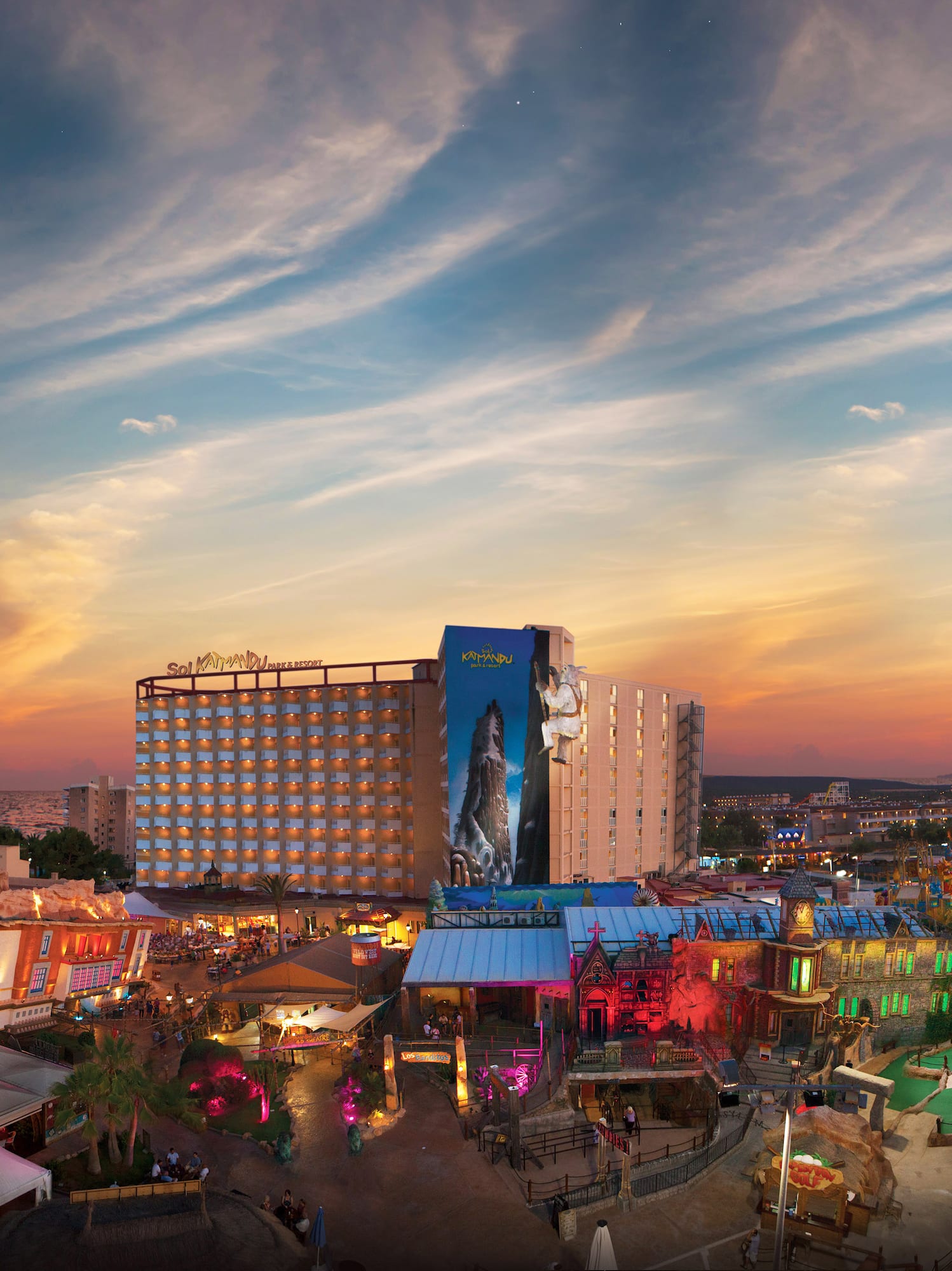 a city with many buildings and a sunset