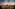 a city with many buildings and a sunset