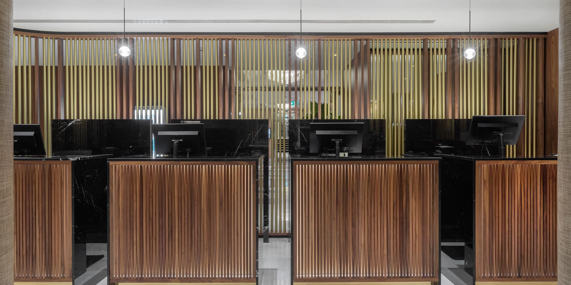 a row of black and wood reception desks