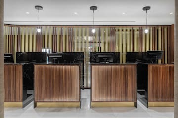 a row of black and wood reception desks