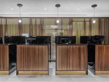 a row of black and wood reception desks