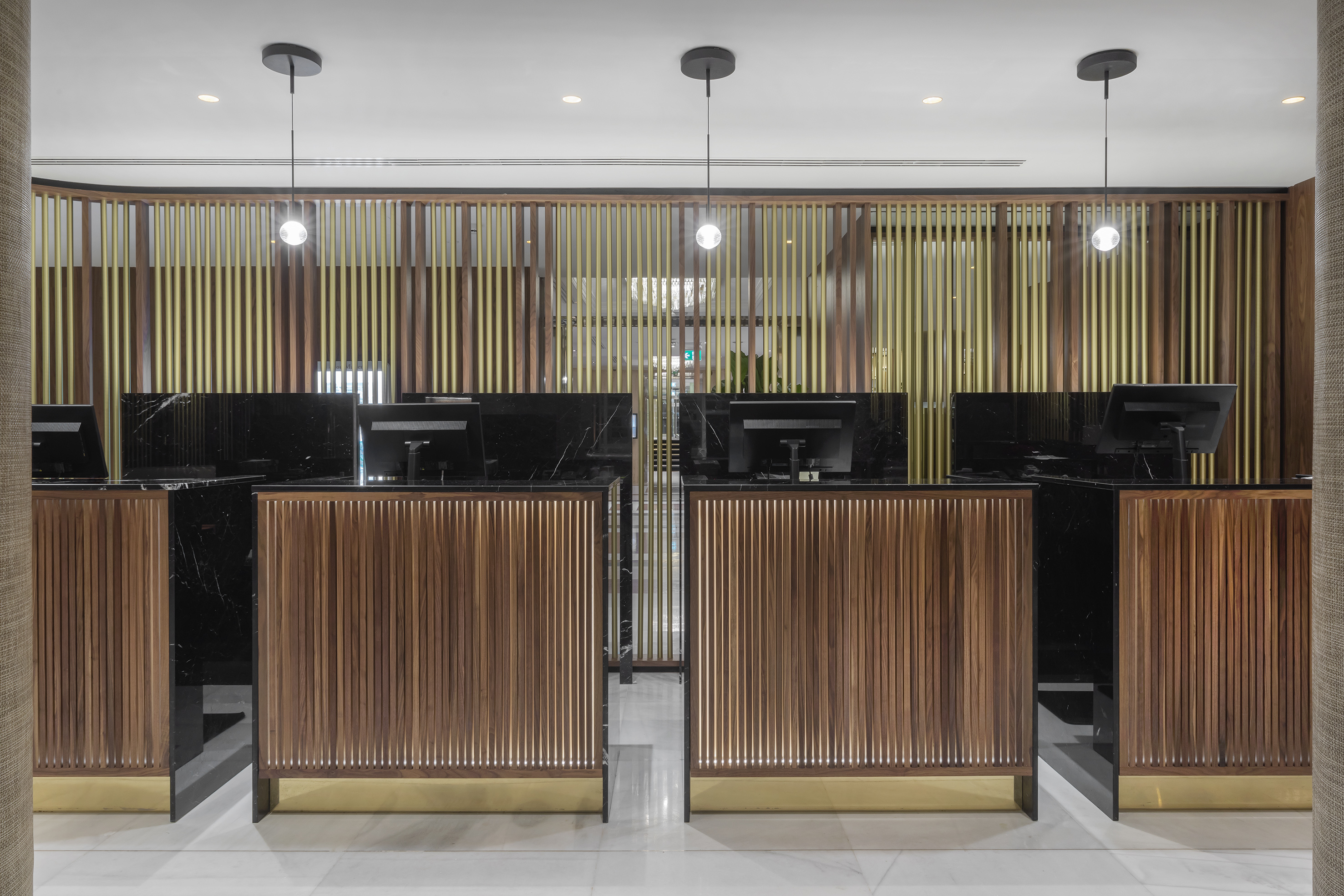 a row of black and wood reception desks