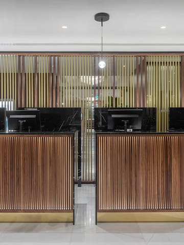 a row of black and wood reception desks