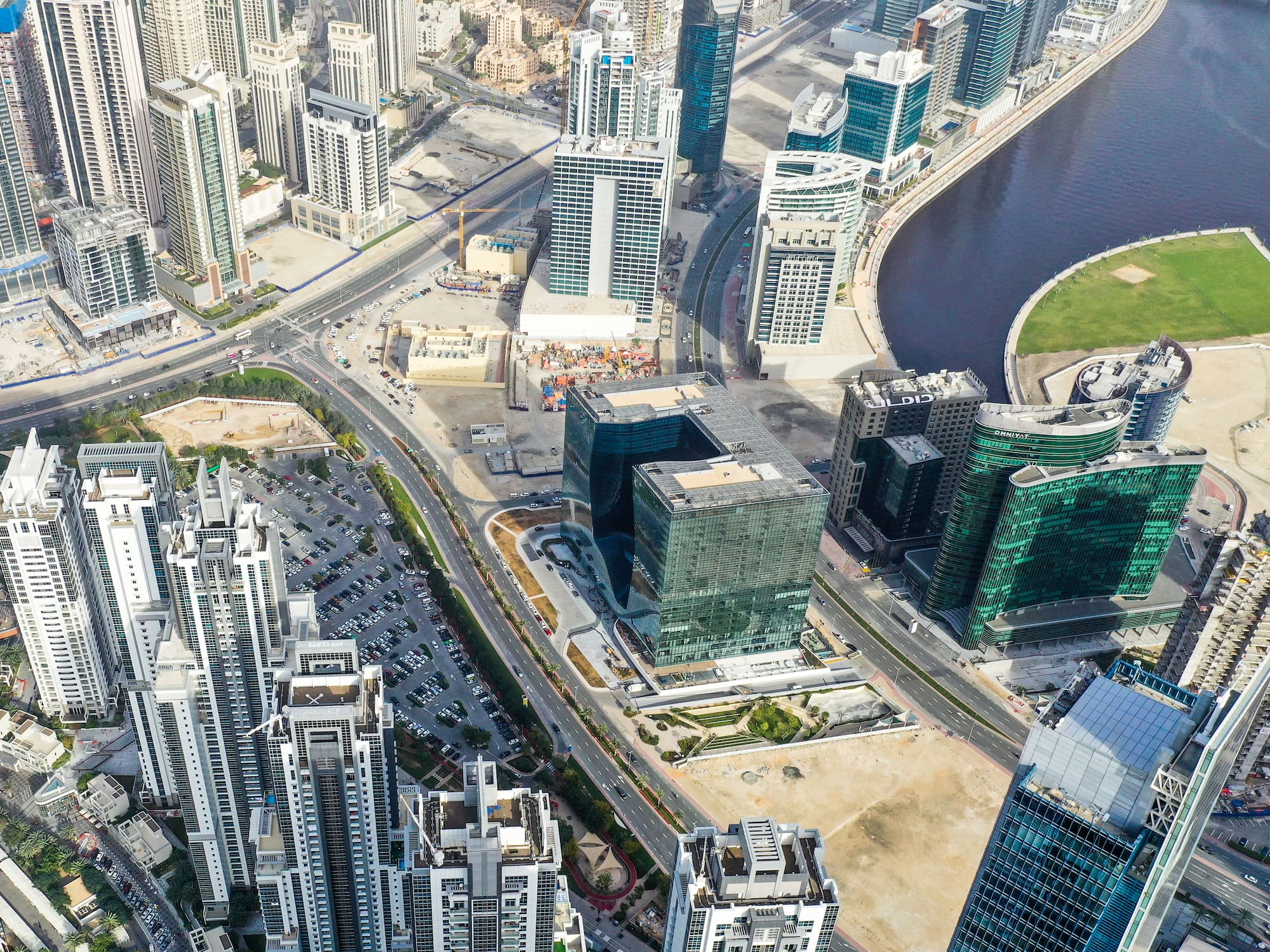 a city with many tall buildings and a river