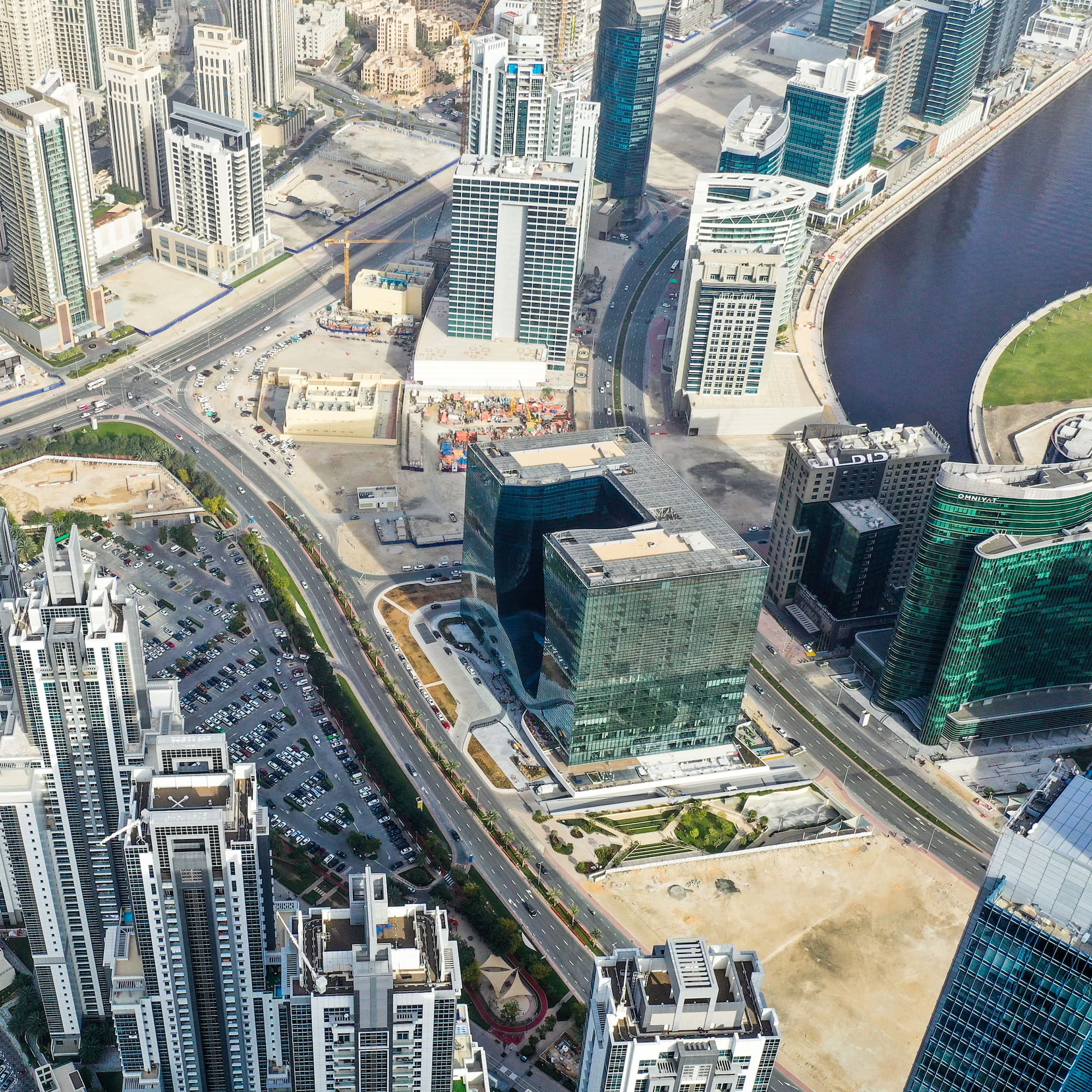 a city with many tall buildings and a river