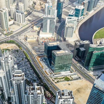 a city with many tall buildings and a river
