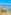 a beach with palm trees and buildings