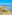 a beach with palm trees and buildings
