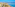 Sunny Costa del Sol beach, hotels, palm trees, ocean, and mountains.