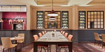 a dining room with a table and chairs