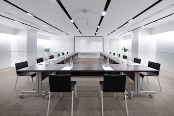 a conference room with a large table and chairs