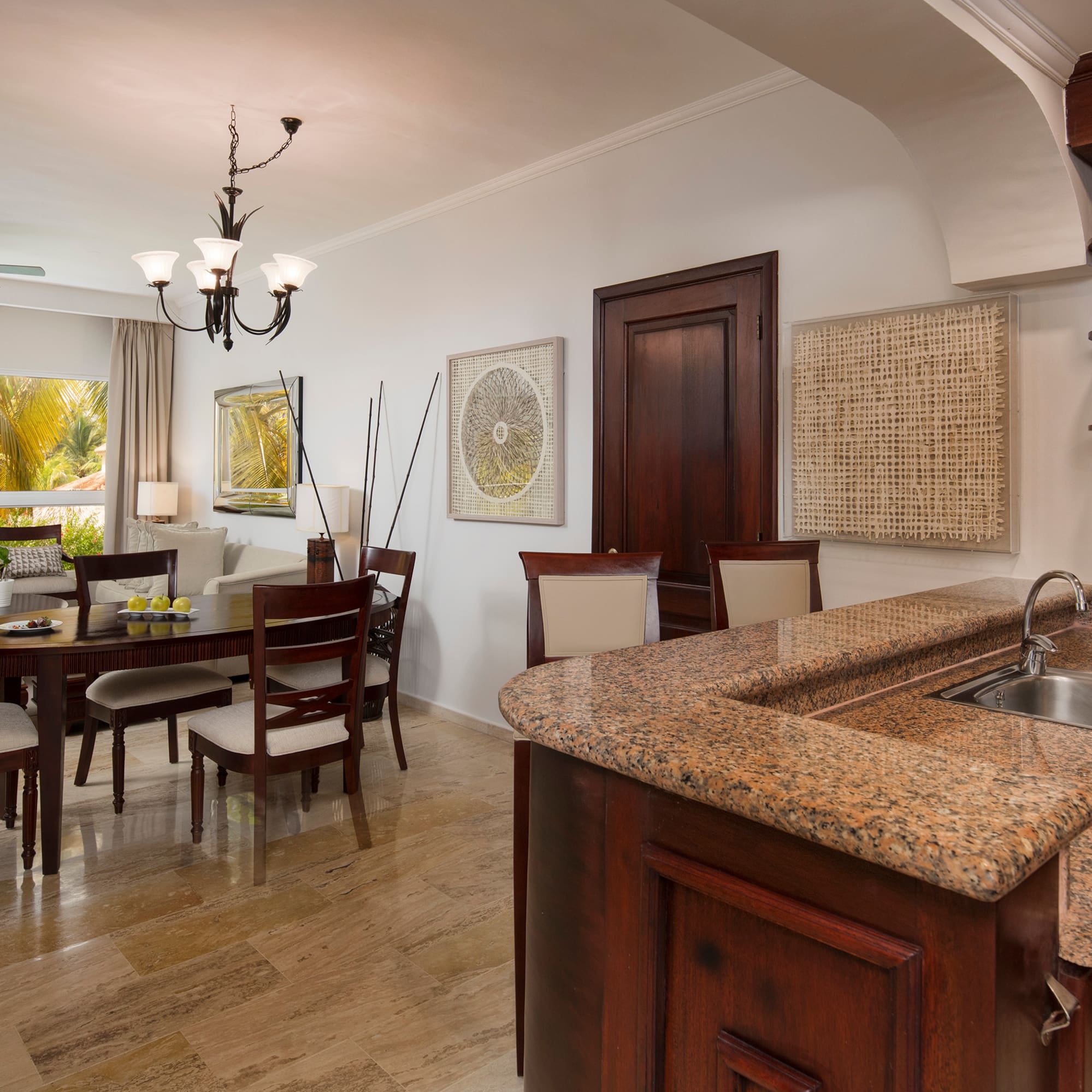 a kitchen and dining room with a marble countertop