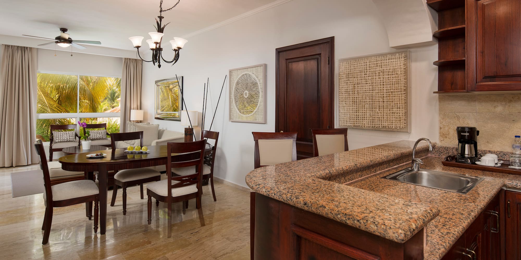 a kitchen and dining room with a marble countertop