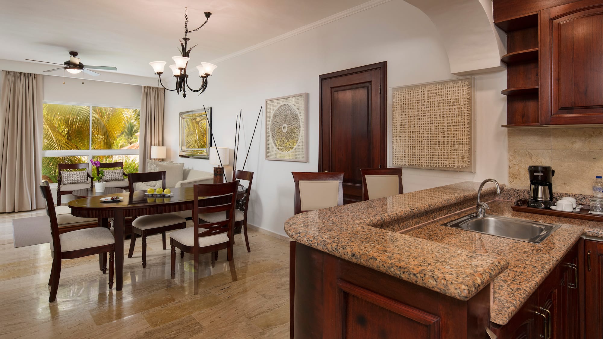 a kitchen and dining room with a marble countertop