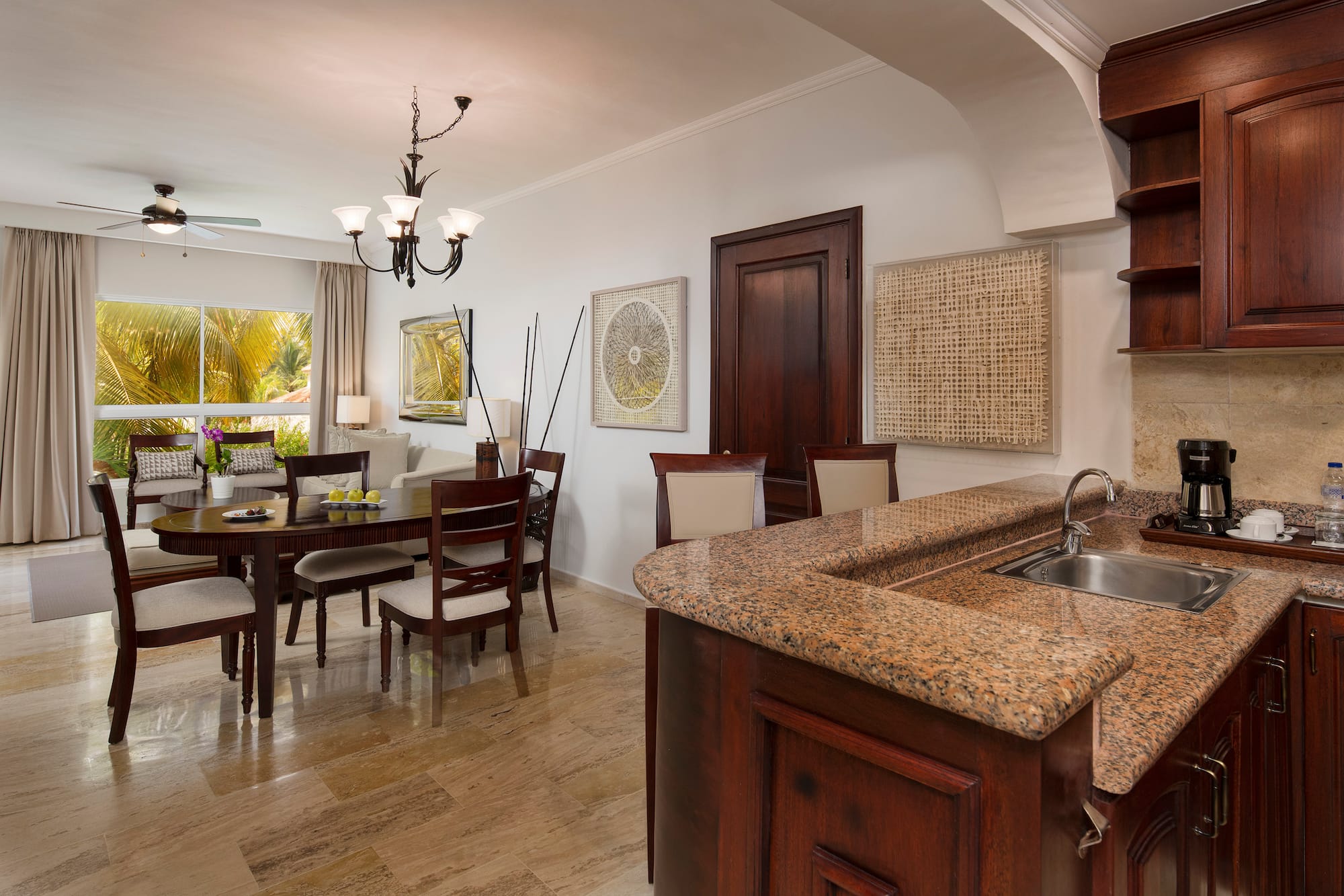 a kitchen and dining room with a marble countertop