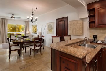 a kitchen and dining room with a marble countertop