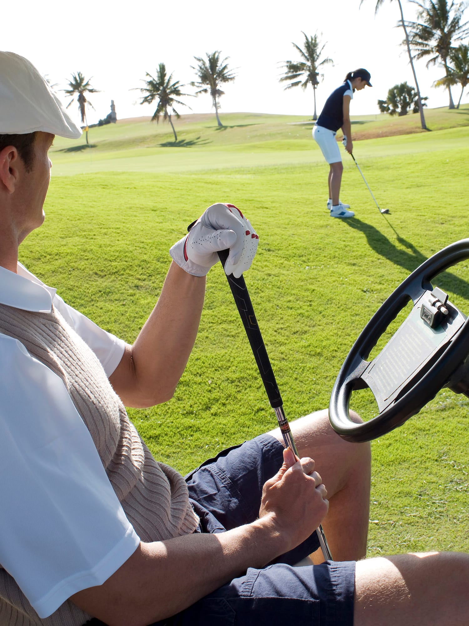 a man holding a golf club