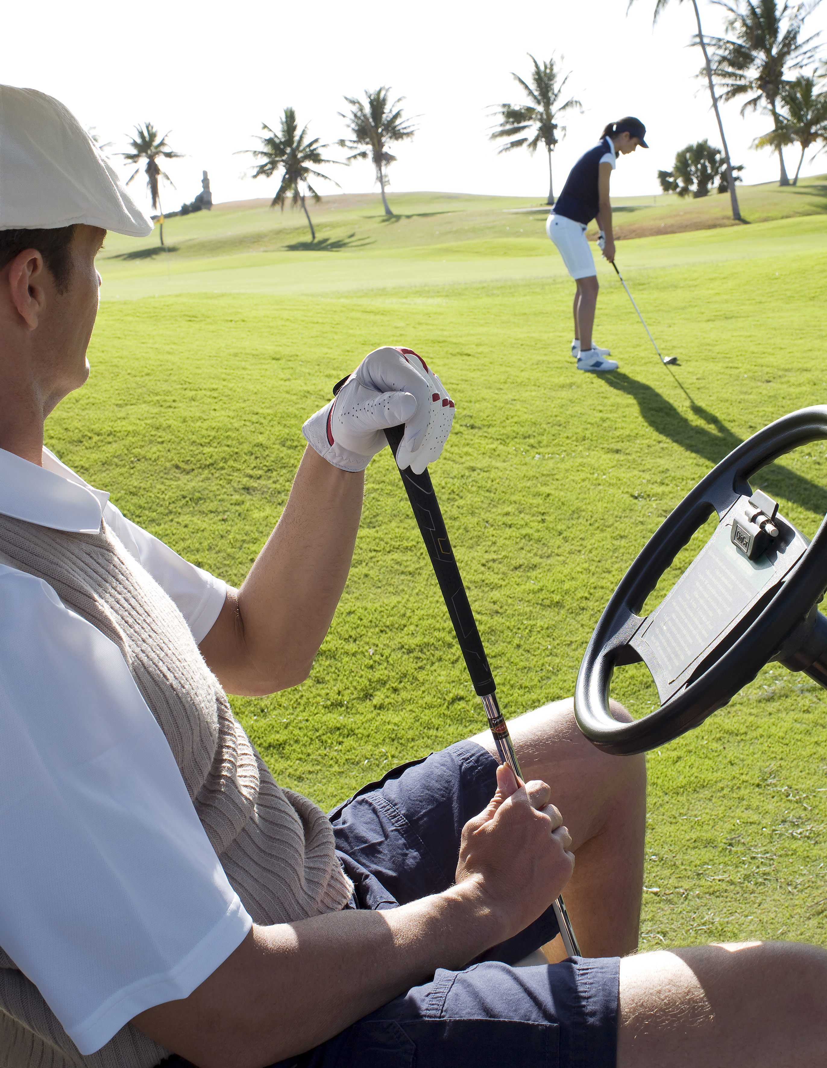 a man holding a golf club