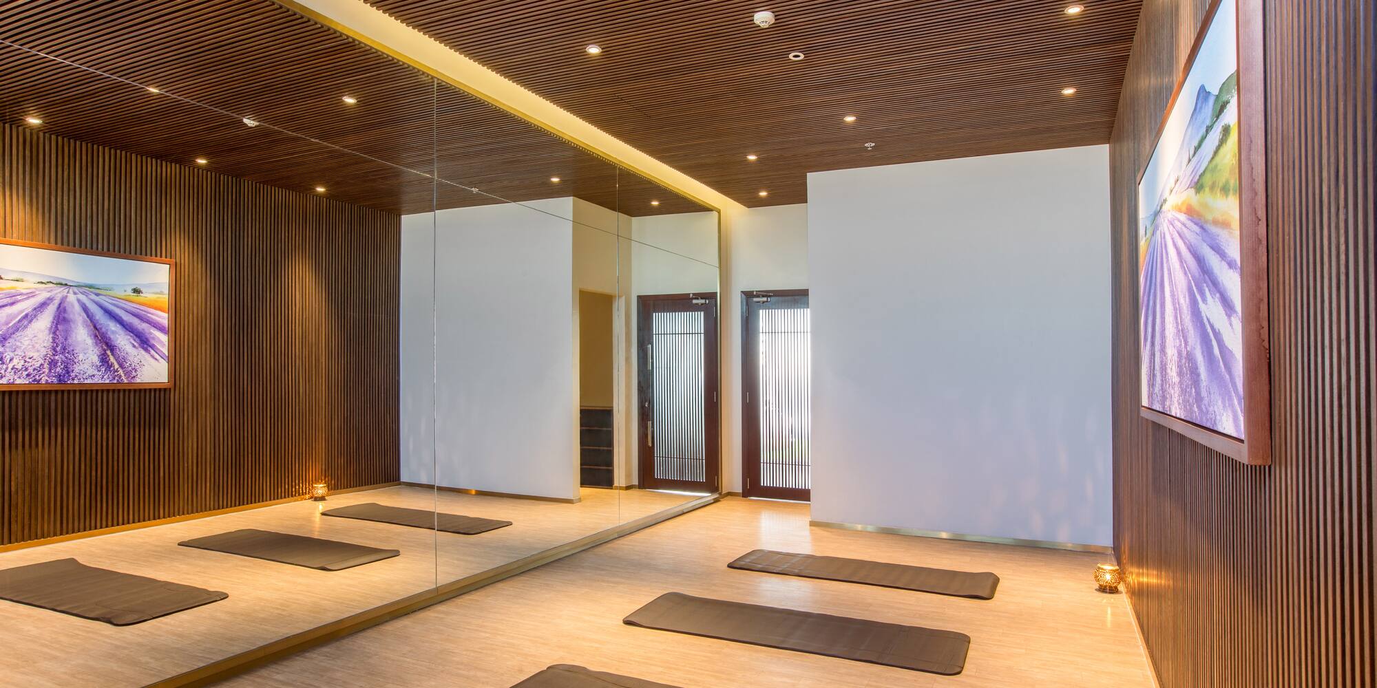 a room with mats and mirrors