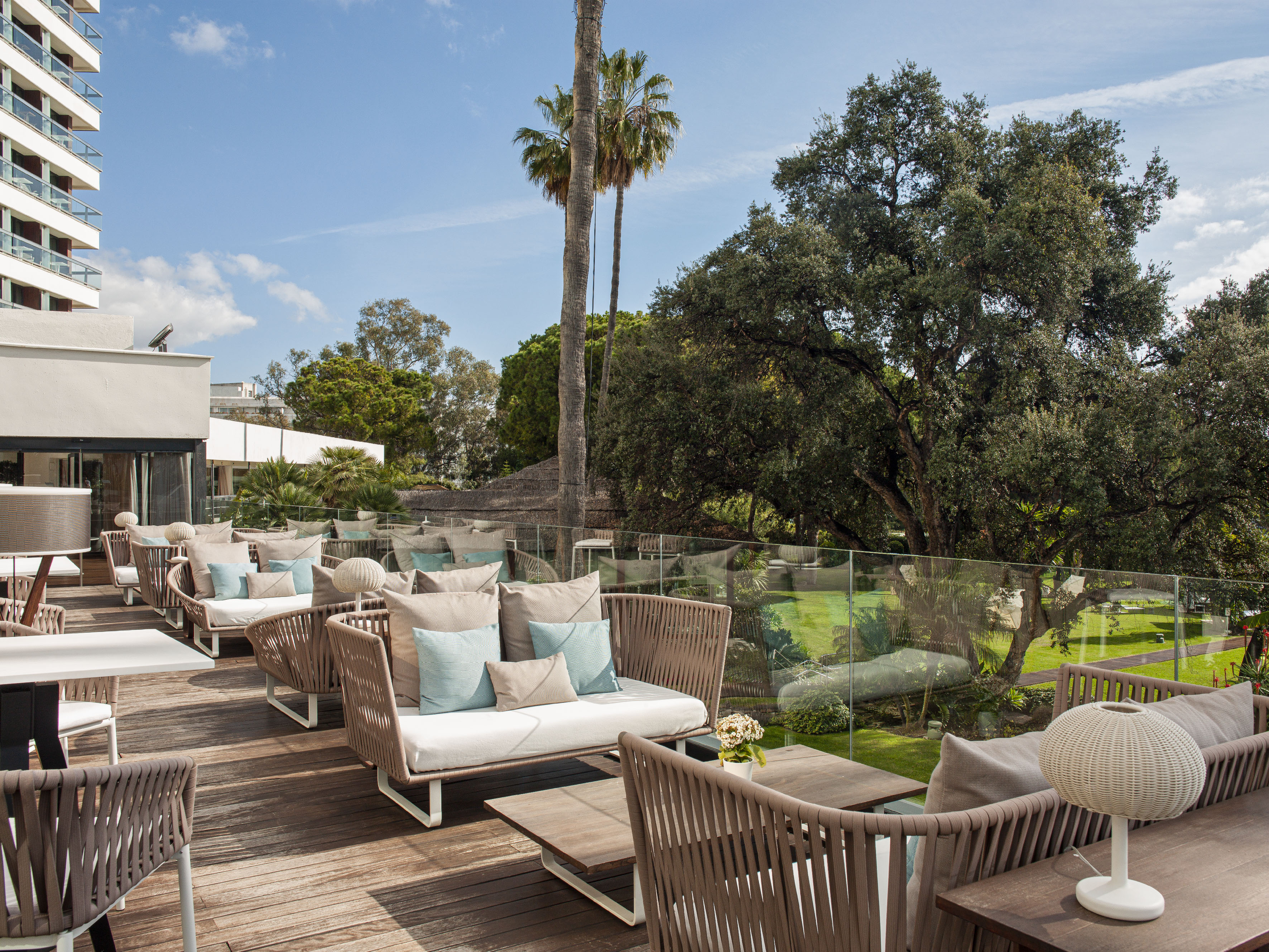 a patio with chairs and tables