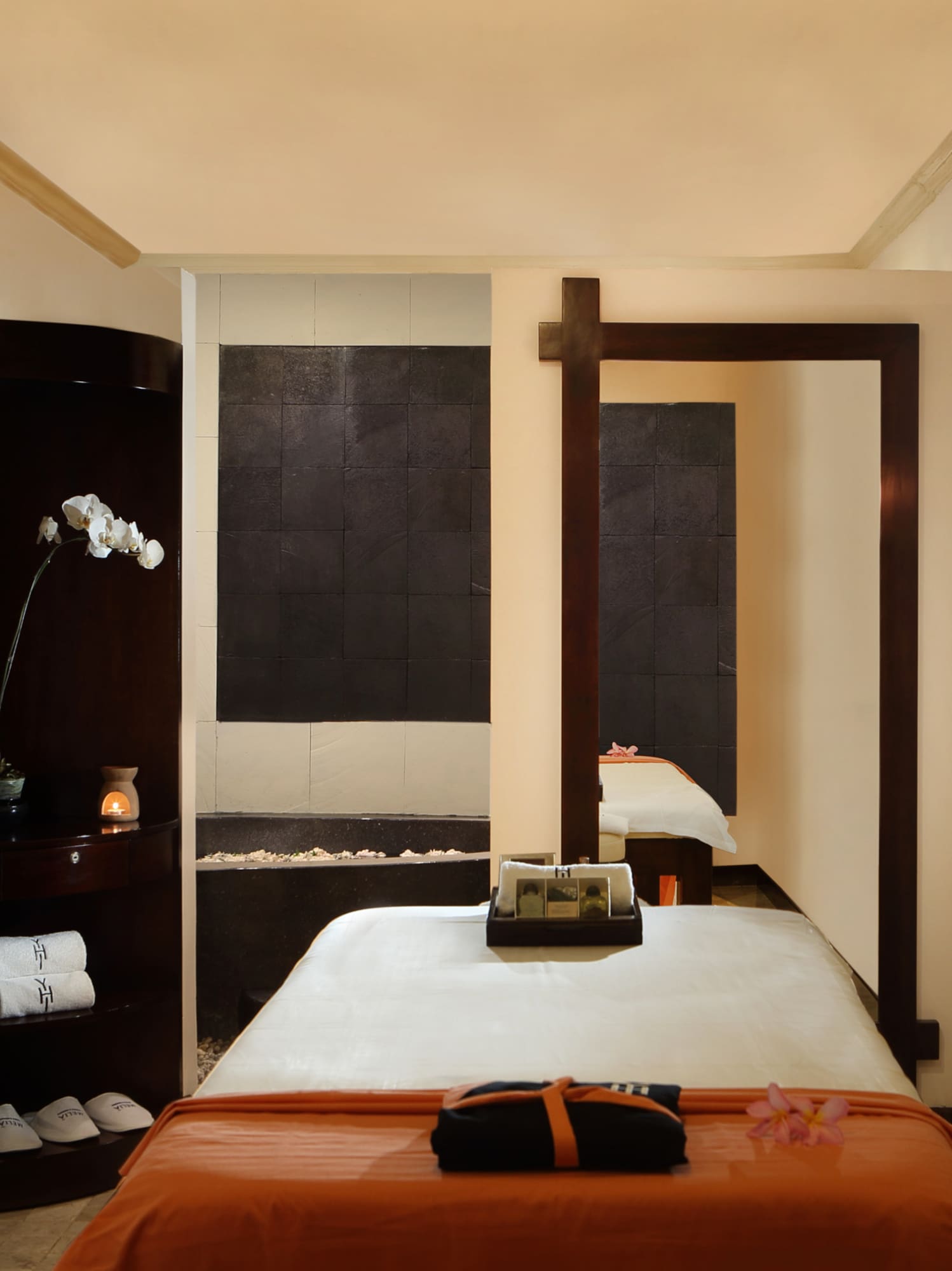 a room with a bed and a mirror