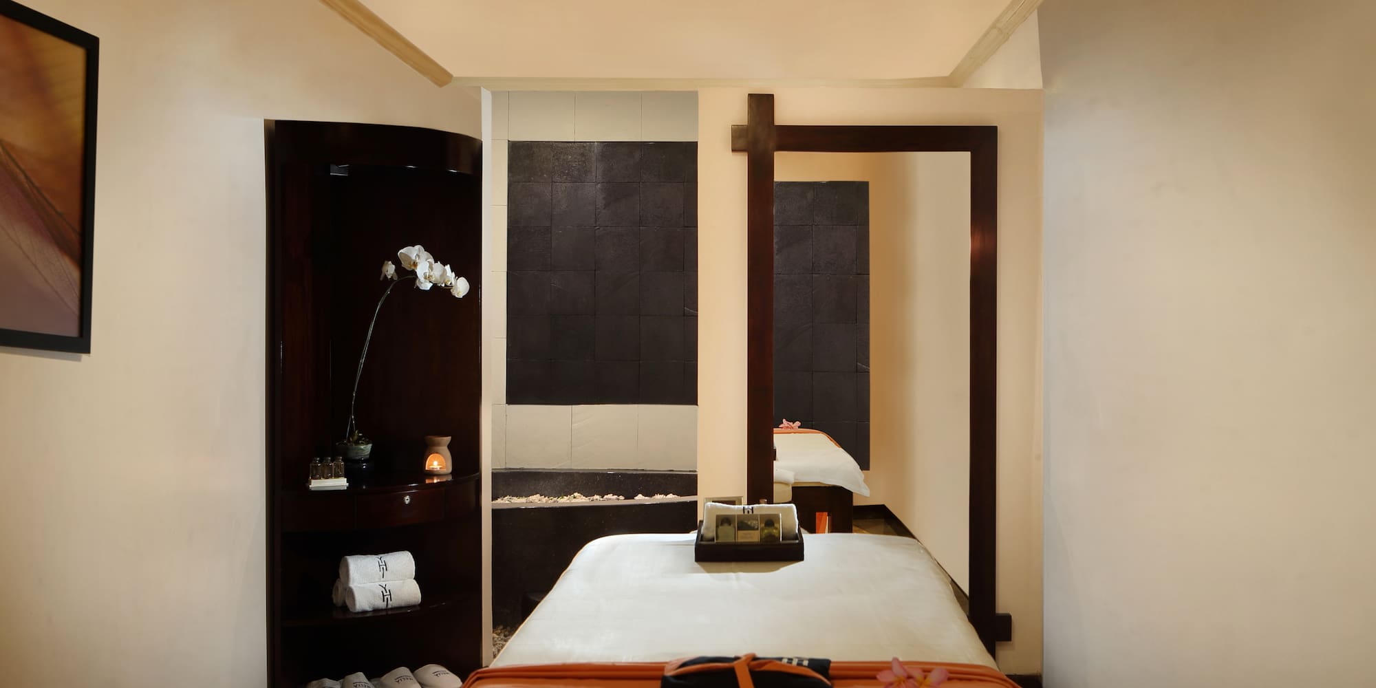 a room with a bed and a mirror