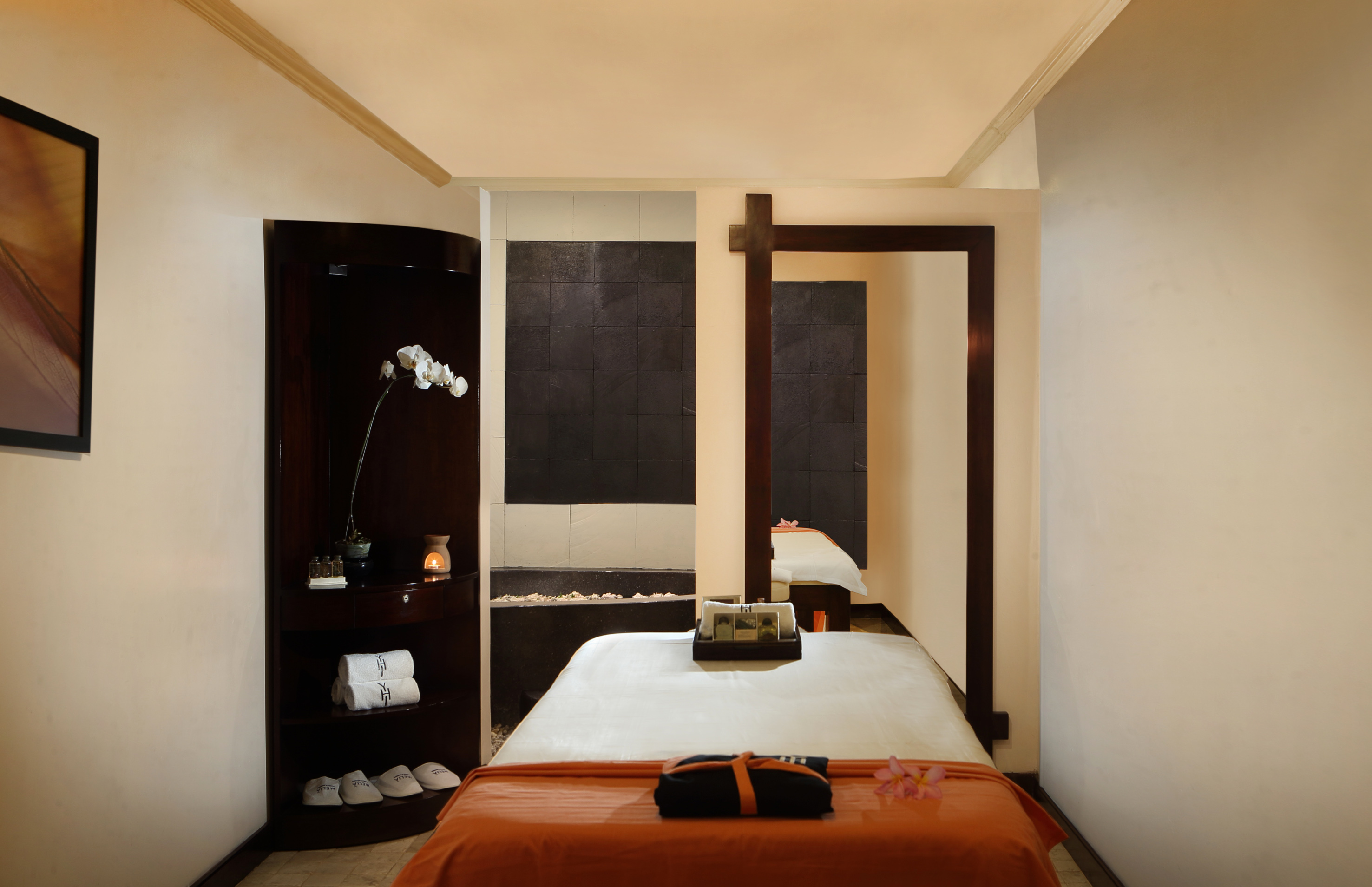 a room with a bed and a mirror