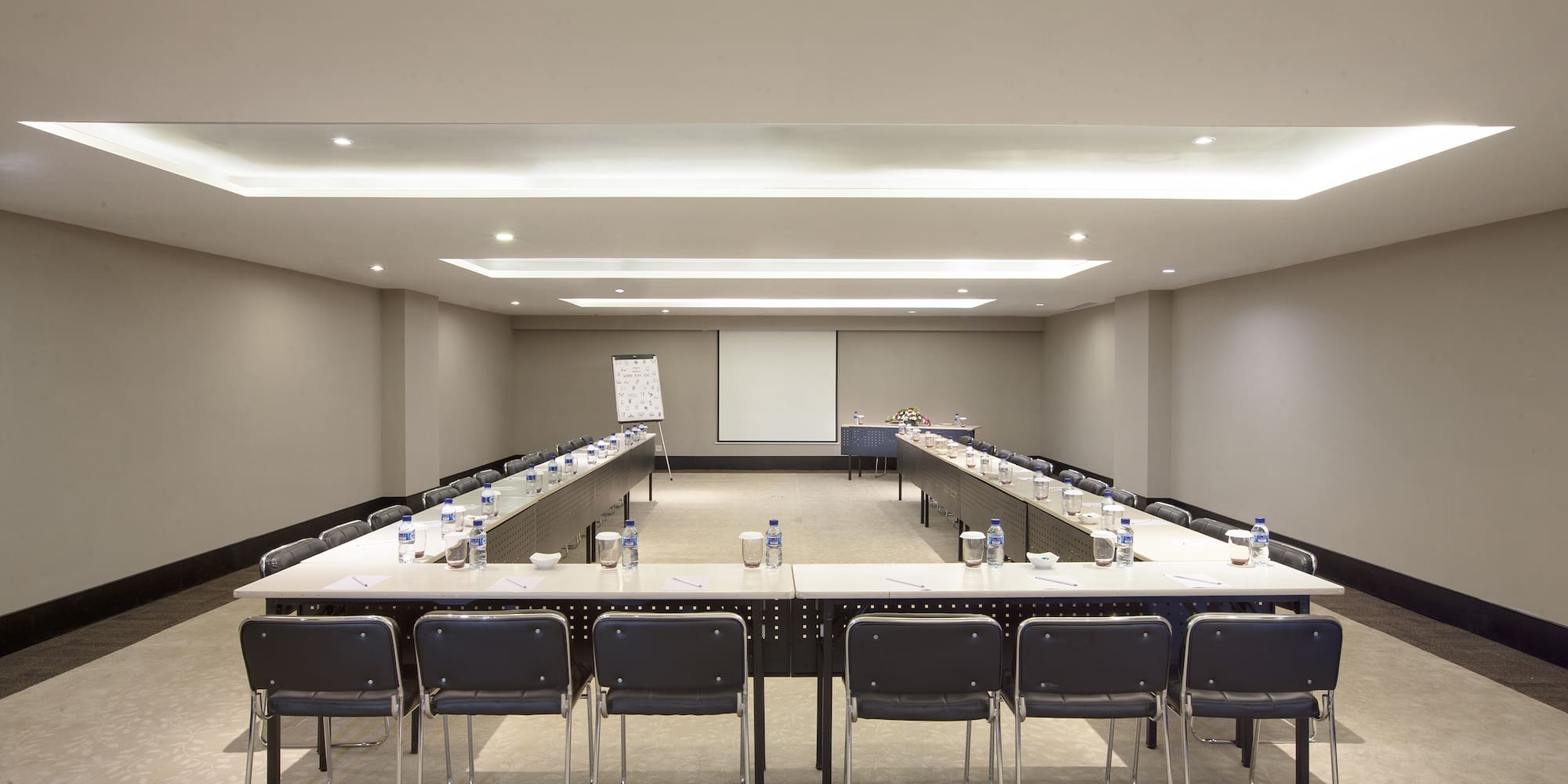 a room with a large table and chairs