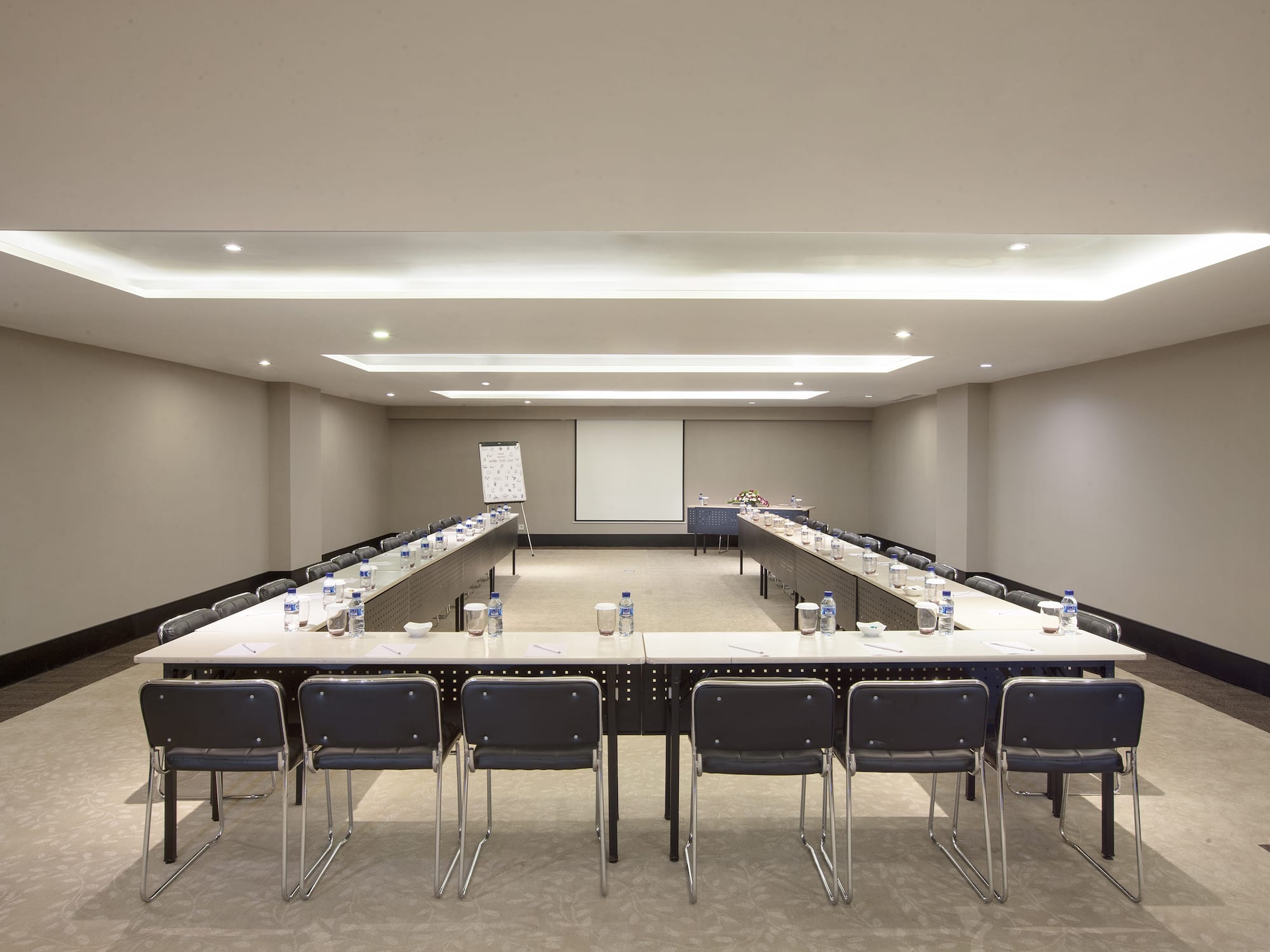 a room with a large table and chairs