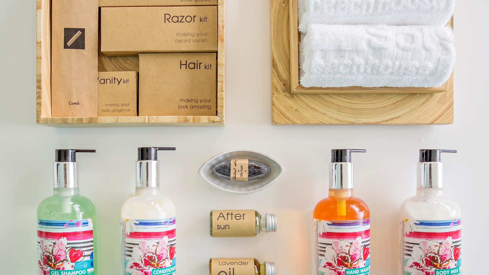 a group of bottles of liquid and a towel