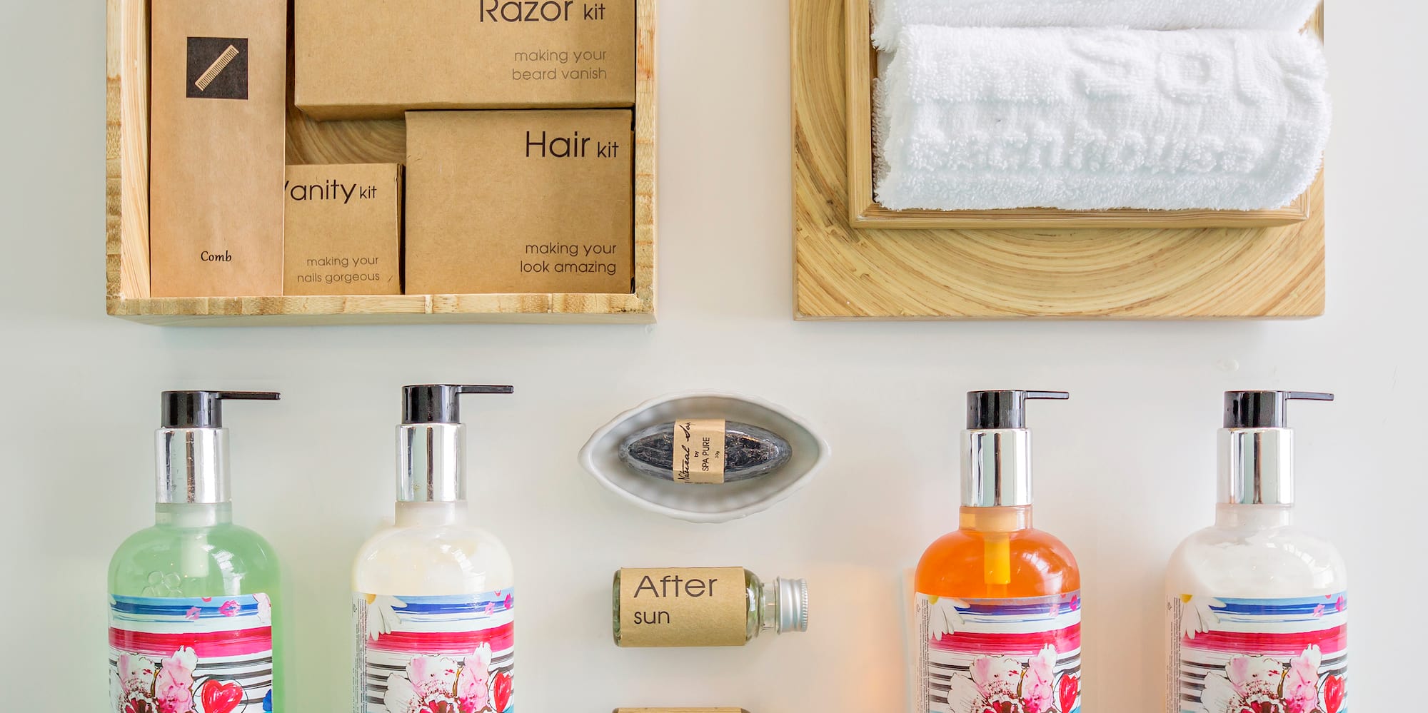 a group of bottles of liquid and a towel