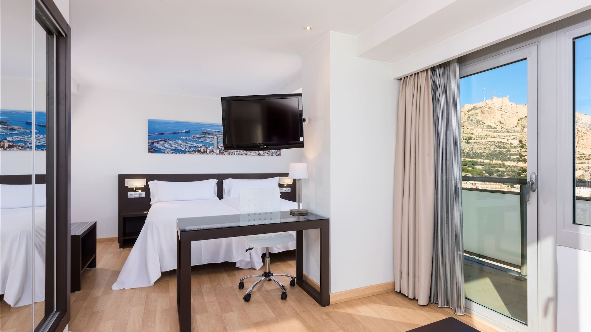 a room with a bed and a desk