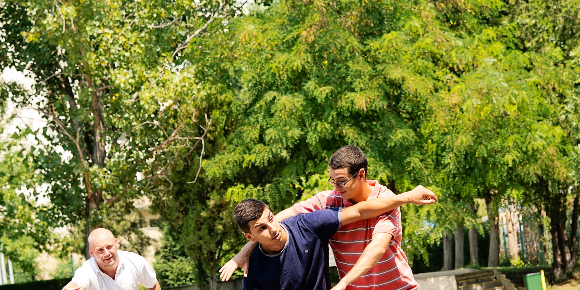 a group of men playing basketball