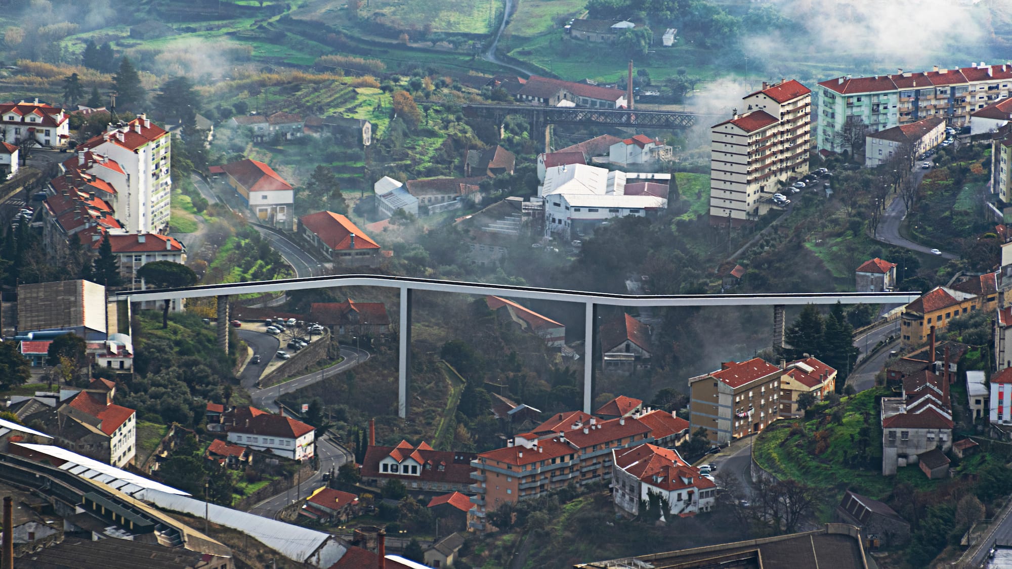 a city with a bridge and buildings