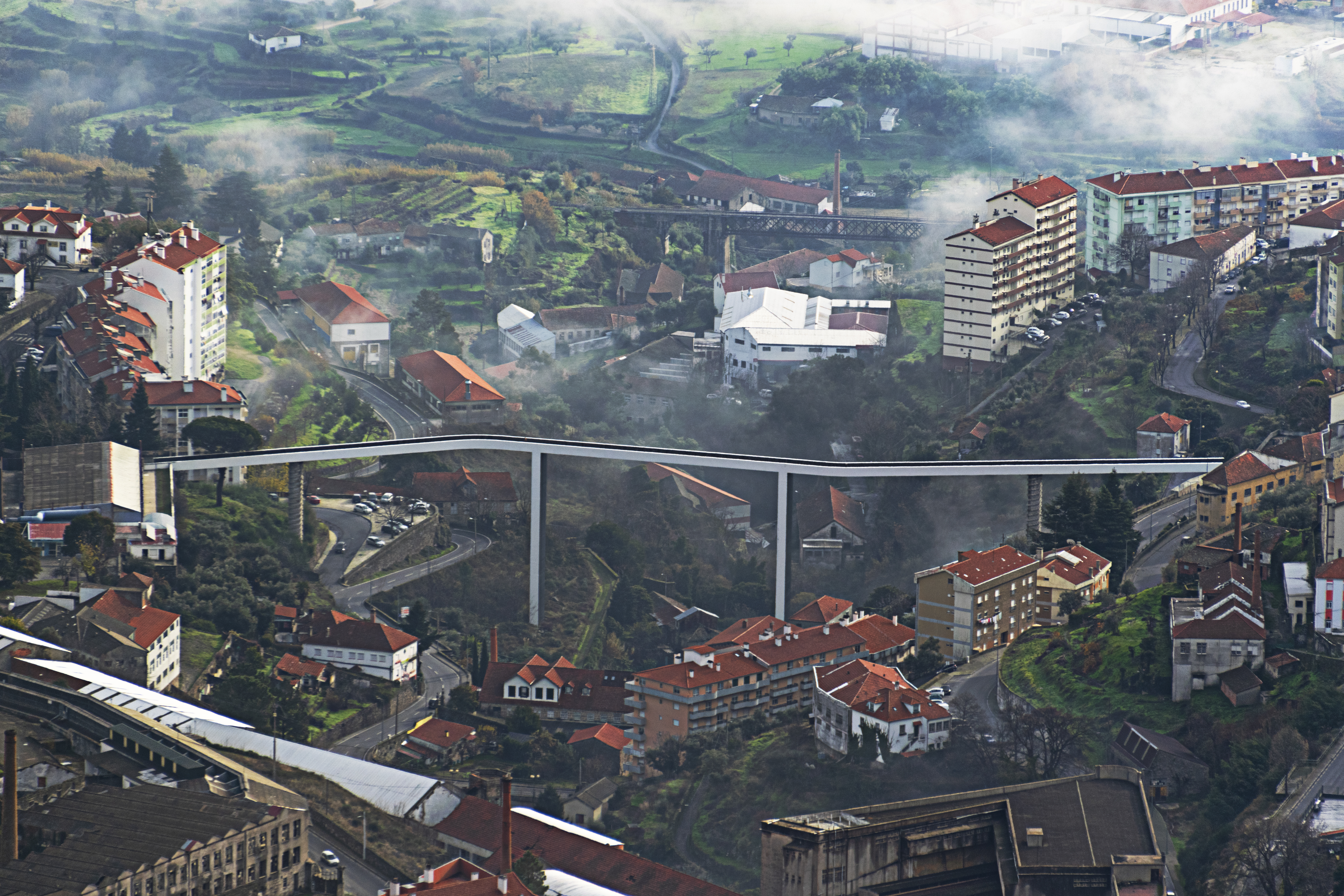 a city with a bridge and buildings