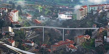 a city with a bridge and buildings