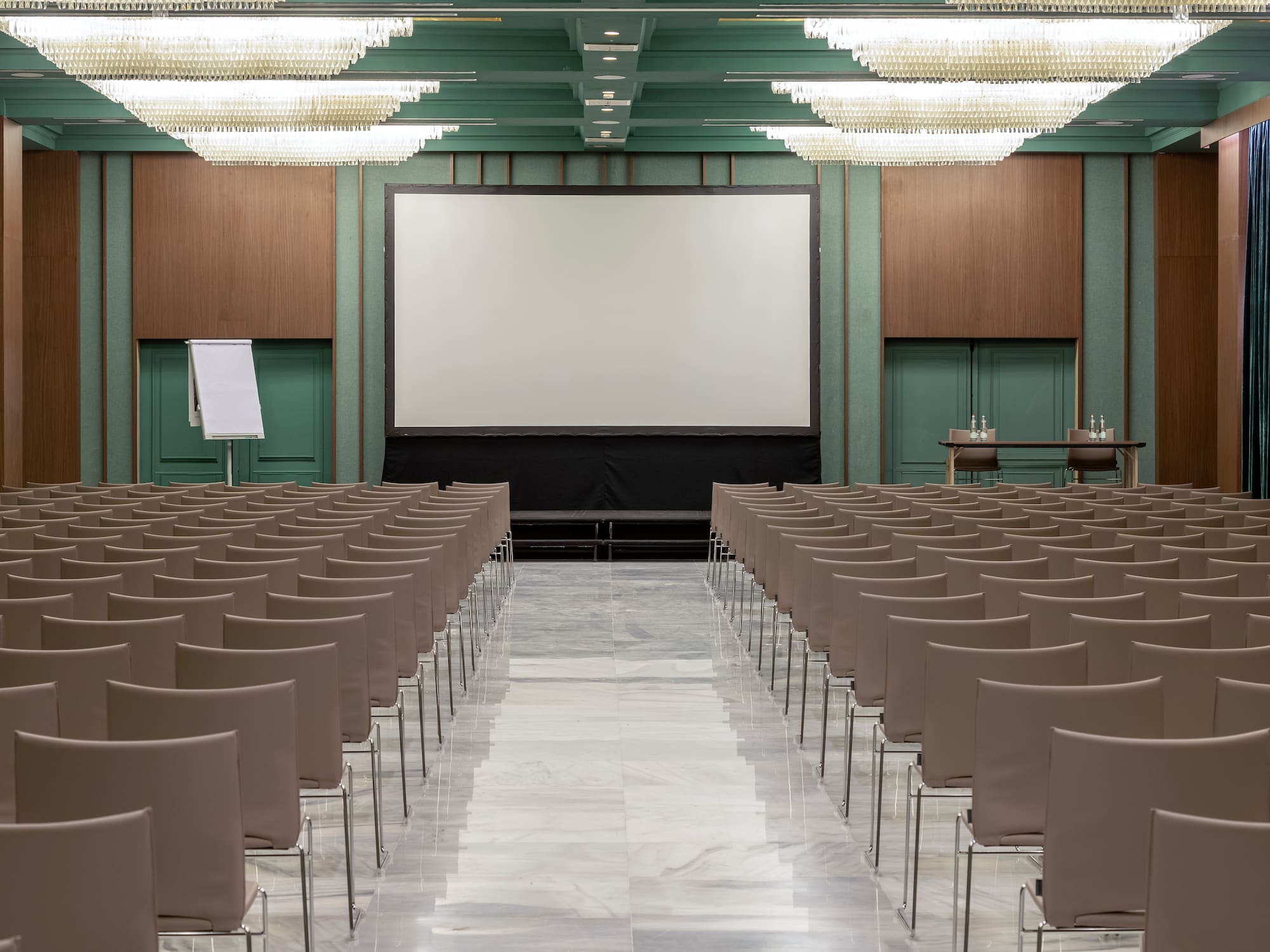 a room with chairs and a projector screen