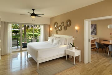 a bedroom with a ceiling fan and a bed
