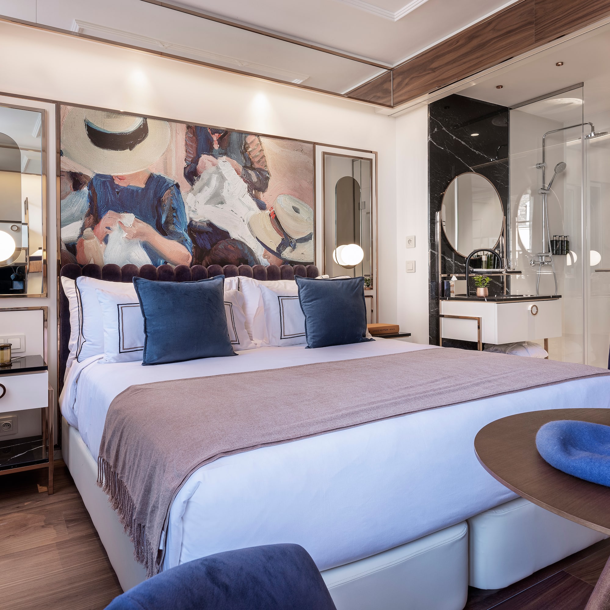 a bedroom with a bed and a round table