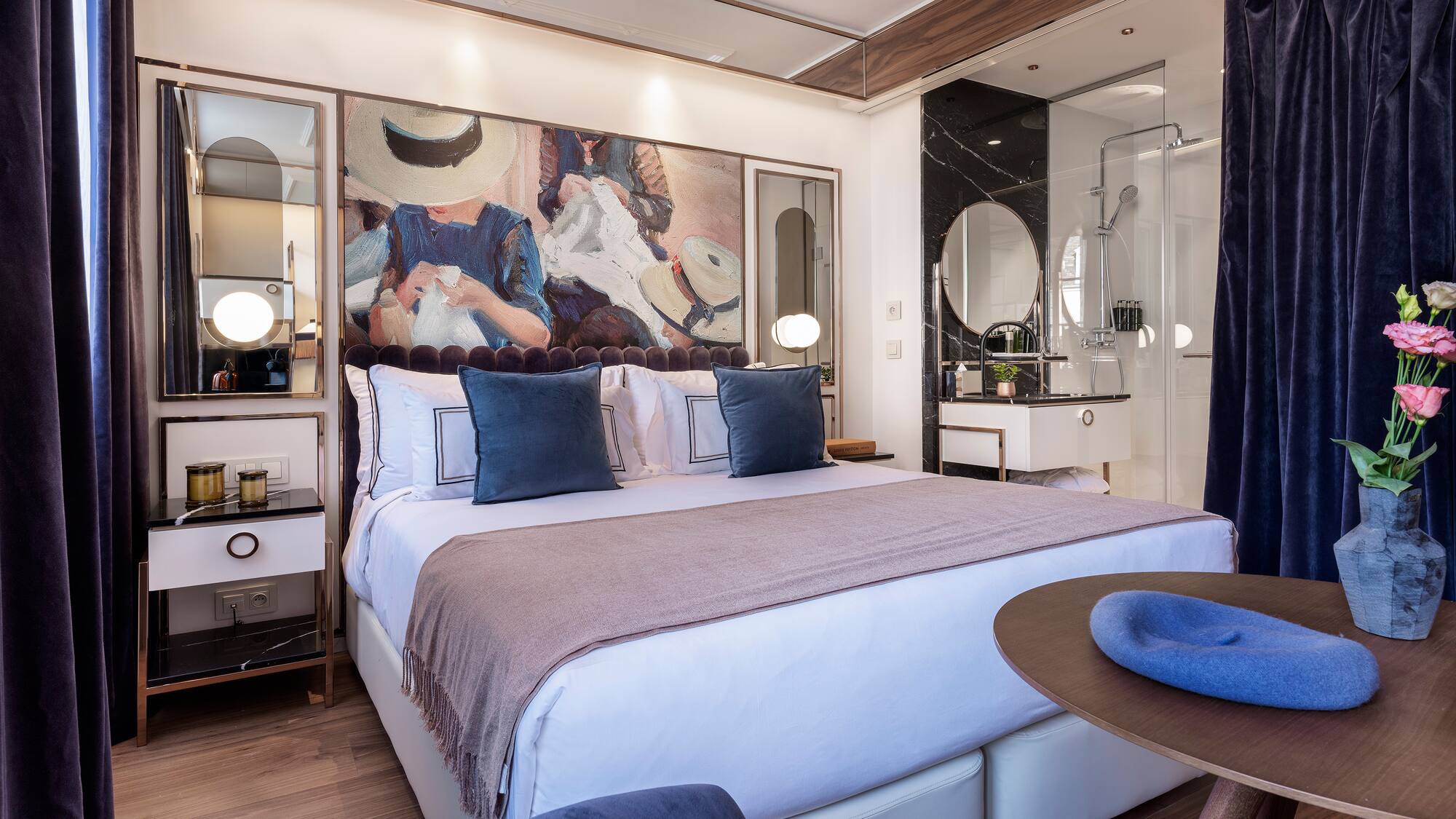 a bedroom with a bed and a round table